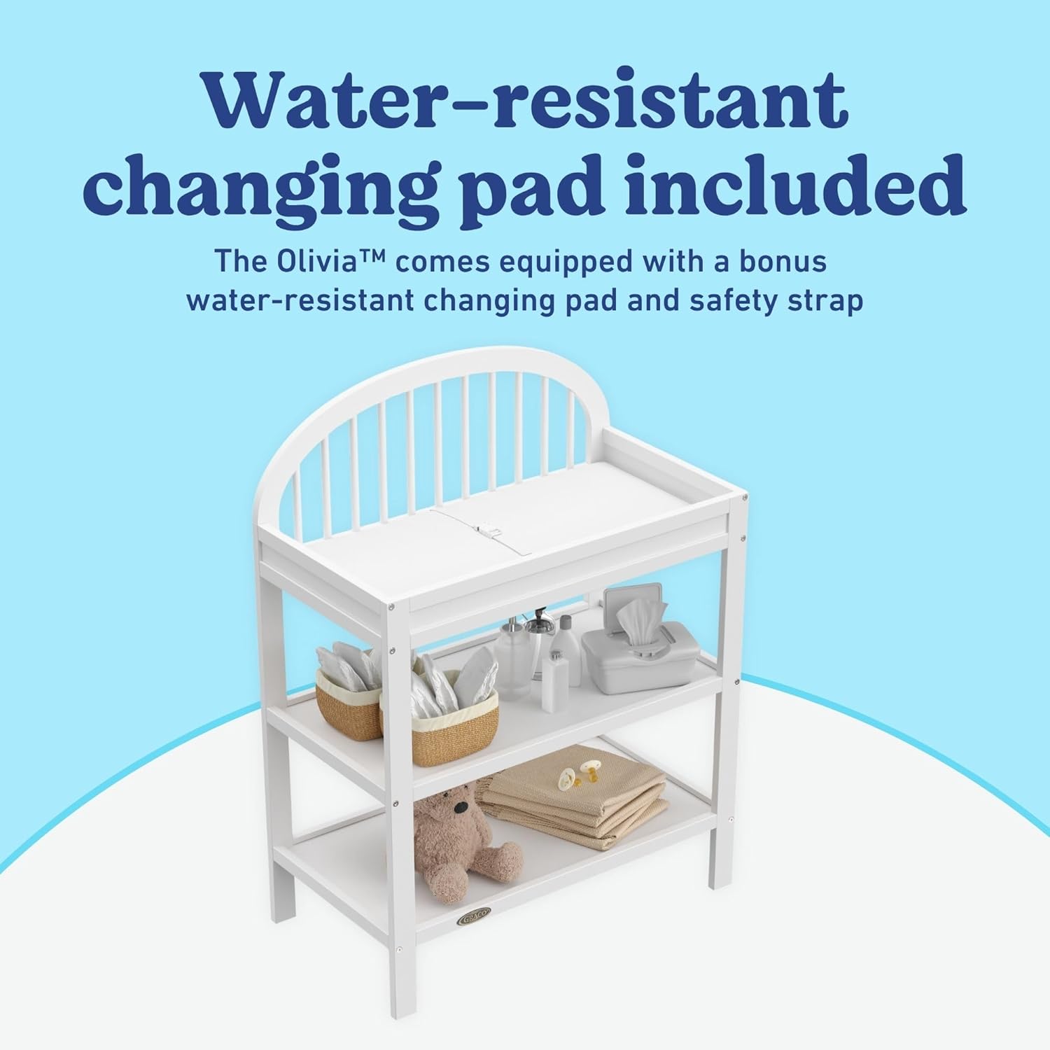 Graco Olivia Changing Table with Water-Resistant Changing Pad (White) - GREENGUARD Gold Certified, Includes Bonus Water-Resistant Changing Pad with Safety Strap, 2 Open Shelves, Stylish Design