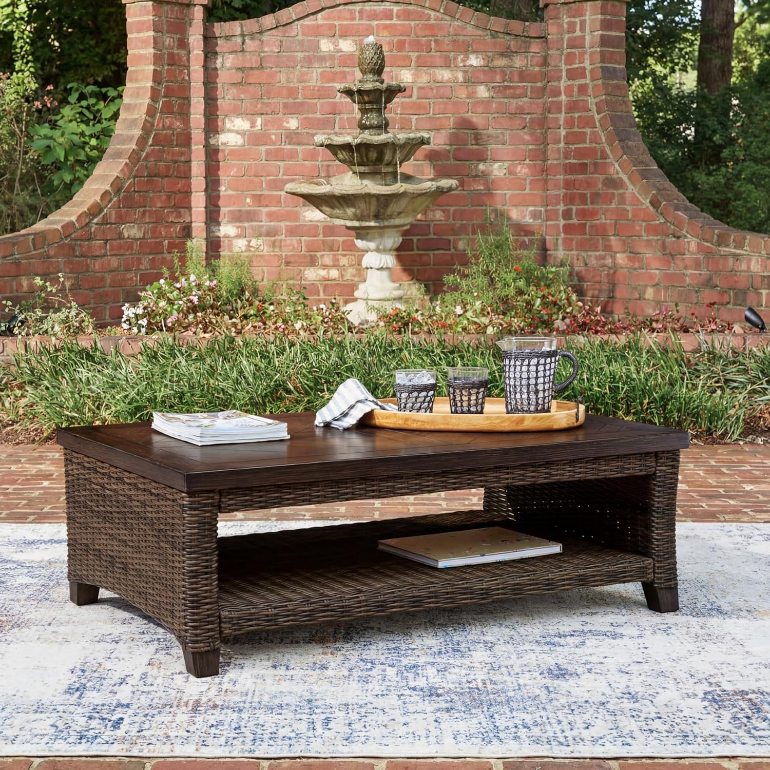 Signature Design by Ashley Drakes Beach Outdoor Coffee Table, Resin Wicker with Aluminum Frame and Wood‑Look Finish for Patio, Deck and Poolside Seating, 48