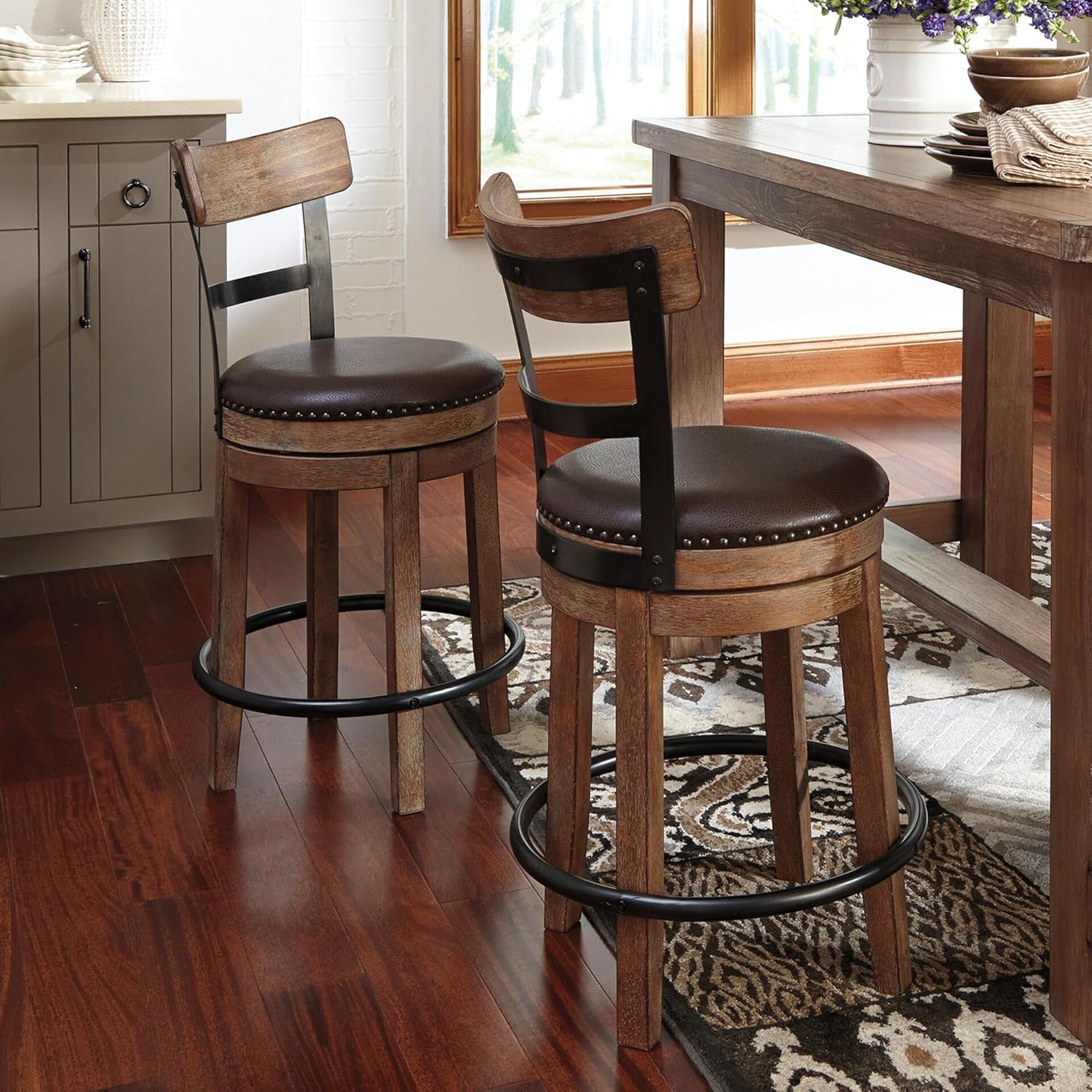 Signature Design by Ashley Pinnadel Bar Stool, Swivel Counter Height Stool Chair With Faux Leather Seat, Wood and Metal Frame for Kitchen Island With Seating, Light Brown