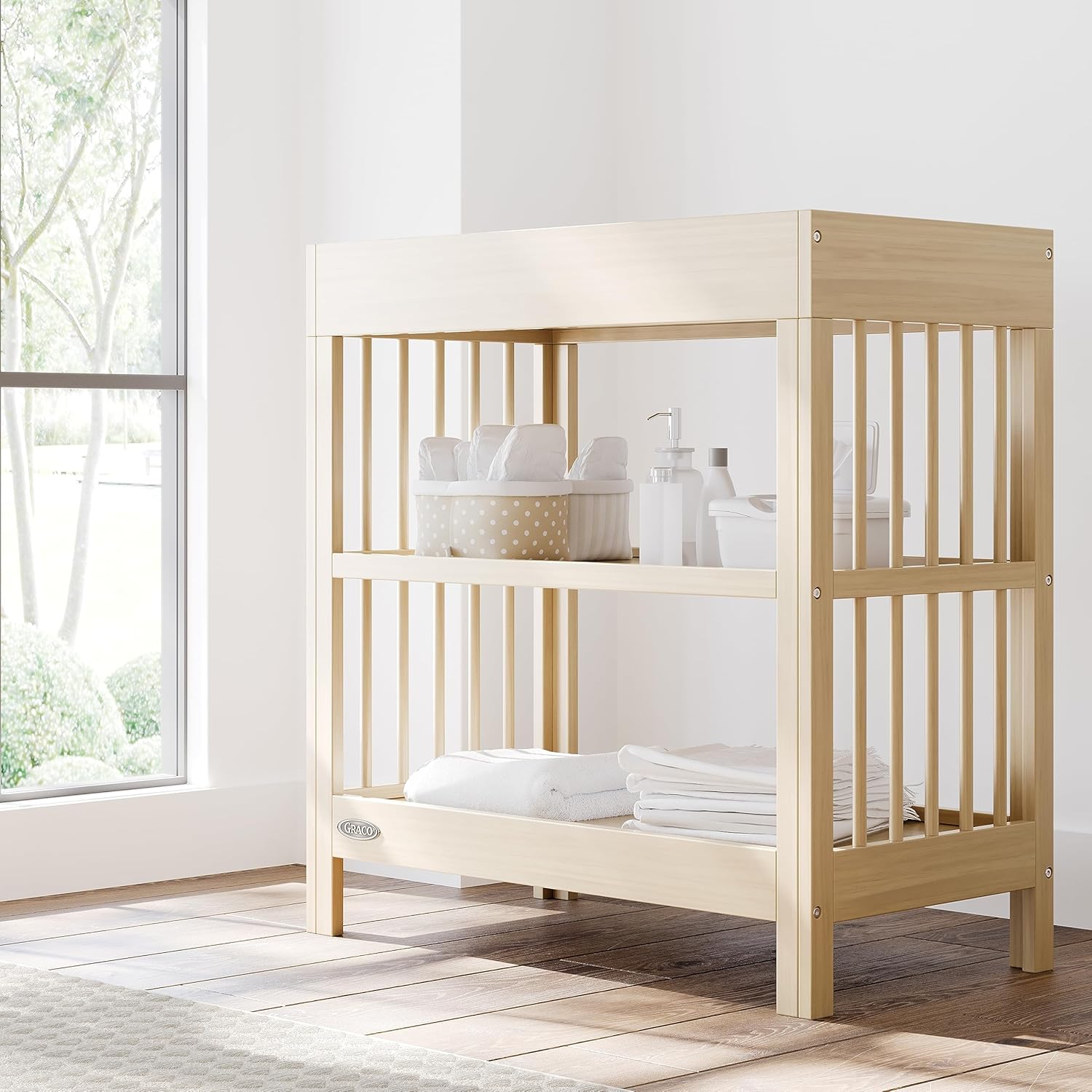 Graco Teddi Changing Table with Water-Resistant Changing Pad (Driftwood) - GREENGUARD Gold Certified, Includes Bonus Water-Resistant Changing Pad with Safety Strap, 2 Shelves, Easy-to-Match