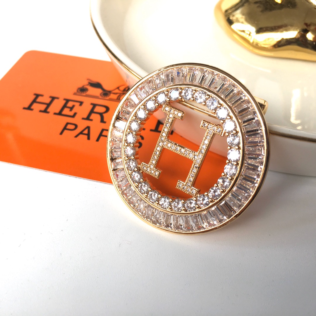 Hermes brooch