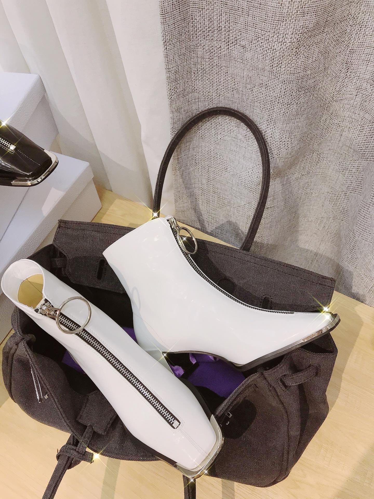 Lost in echo boots with large round buckle