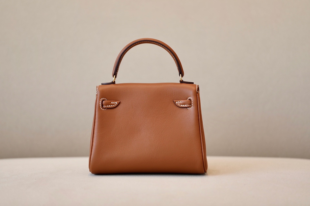 Kelly dolly material using swift cowhide gold brown spell coffee