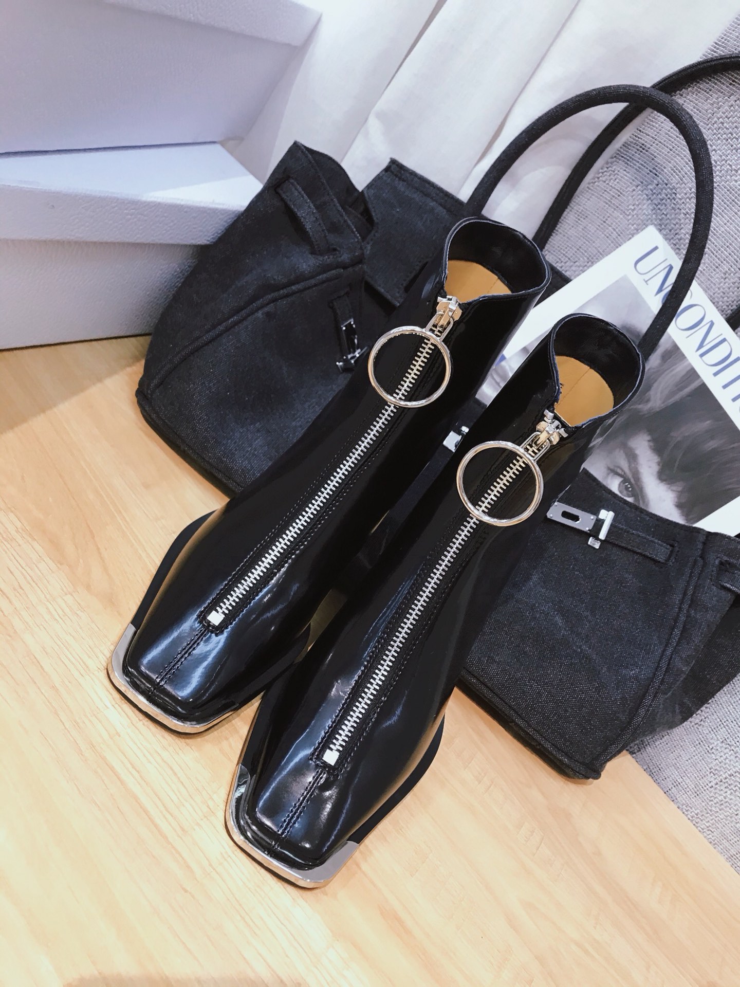 Lost in echo boots with large round buckle