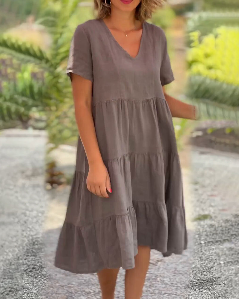 Vestido de algodón y lino con escote de pico en color liso