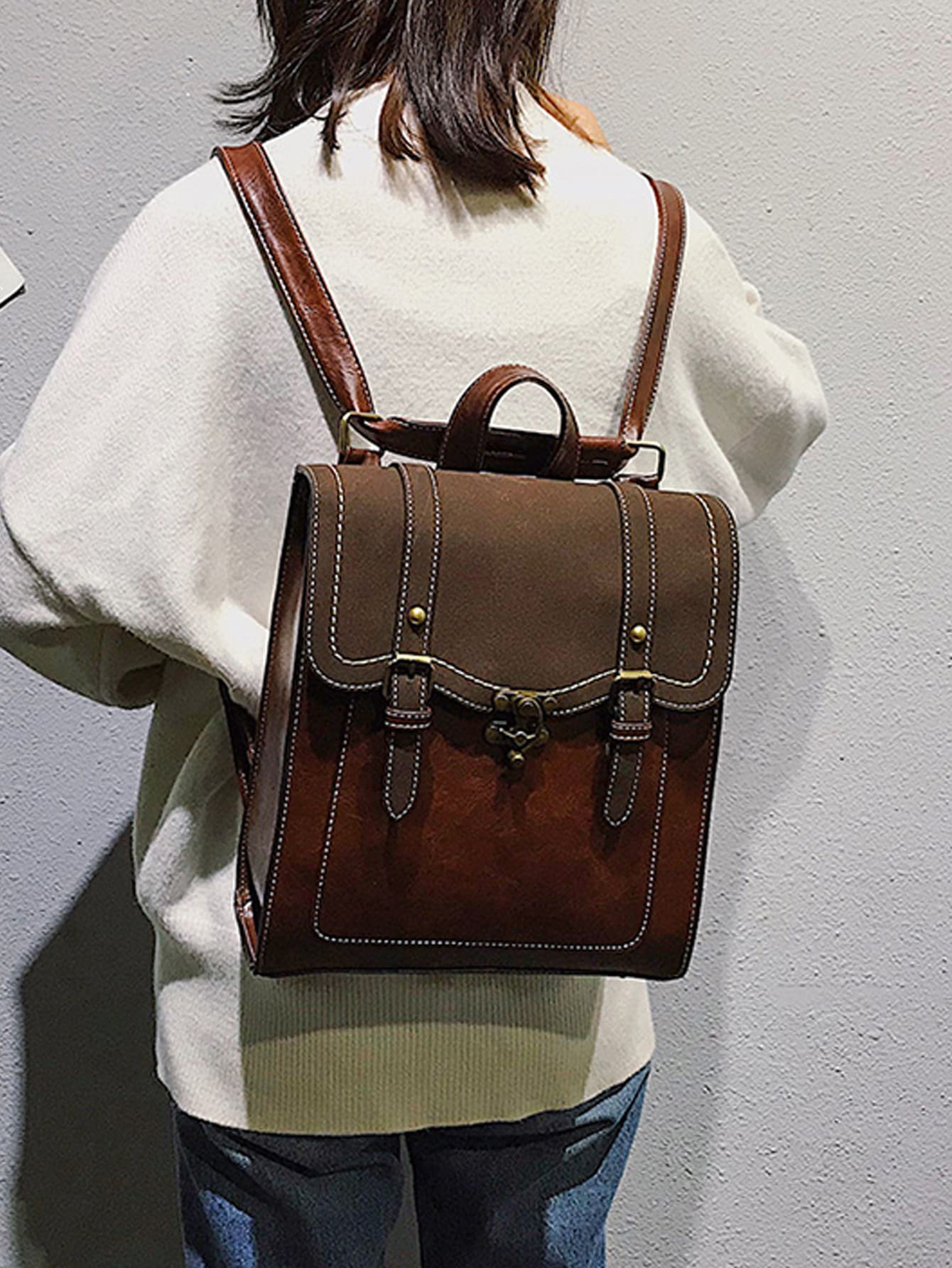 Double buckle decorative flip back backpack