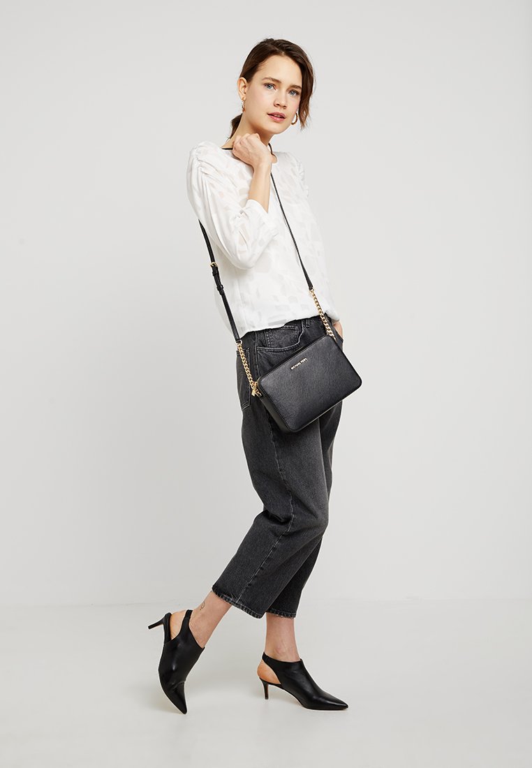 JET SET TRAVEL CROSSBODY - Across body bag
