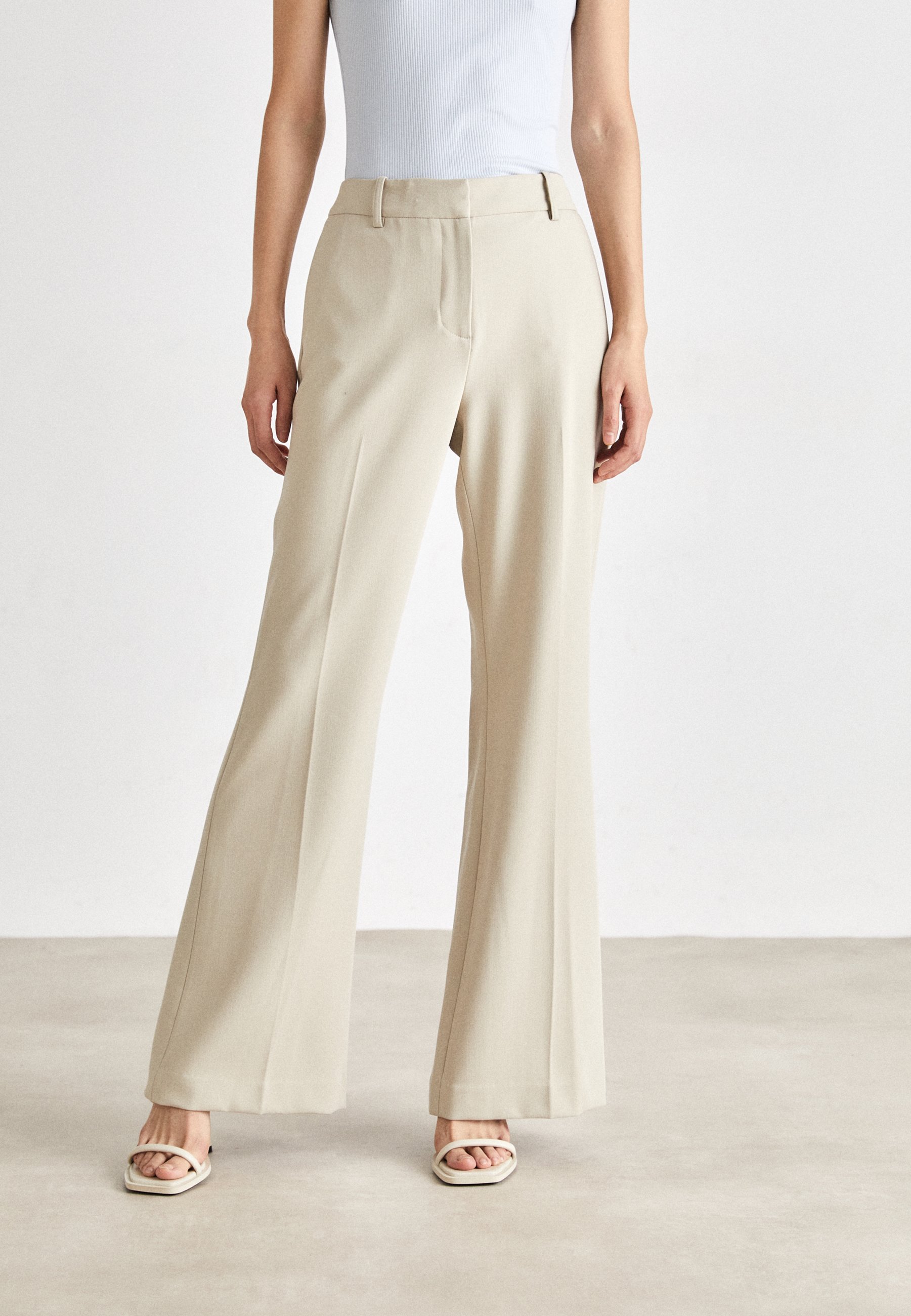 HIGH WAIST FLARE PANT - Trousers