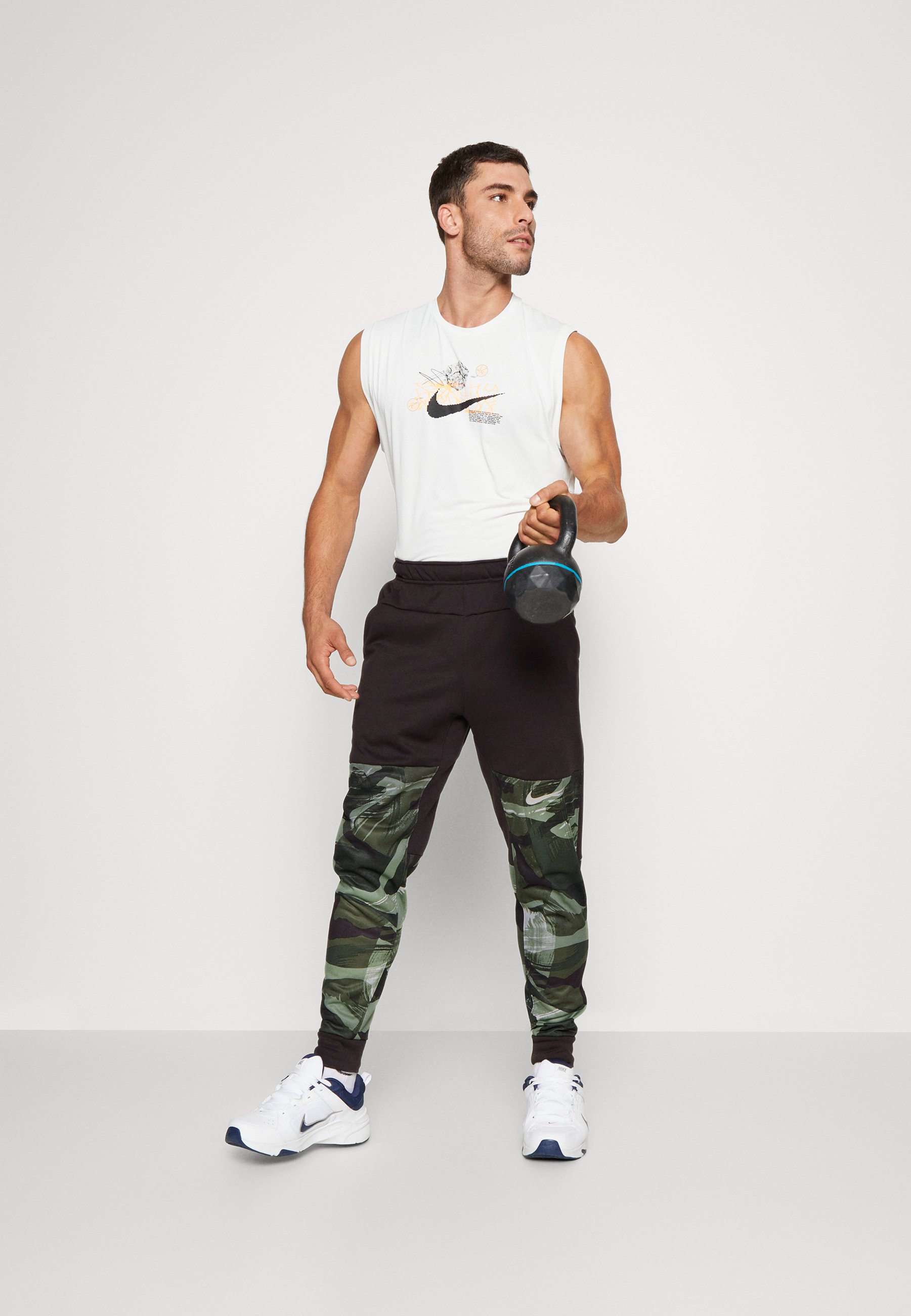PANT TAPER CAMO - Tracksuit bottoms