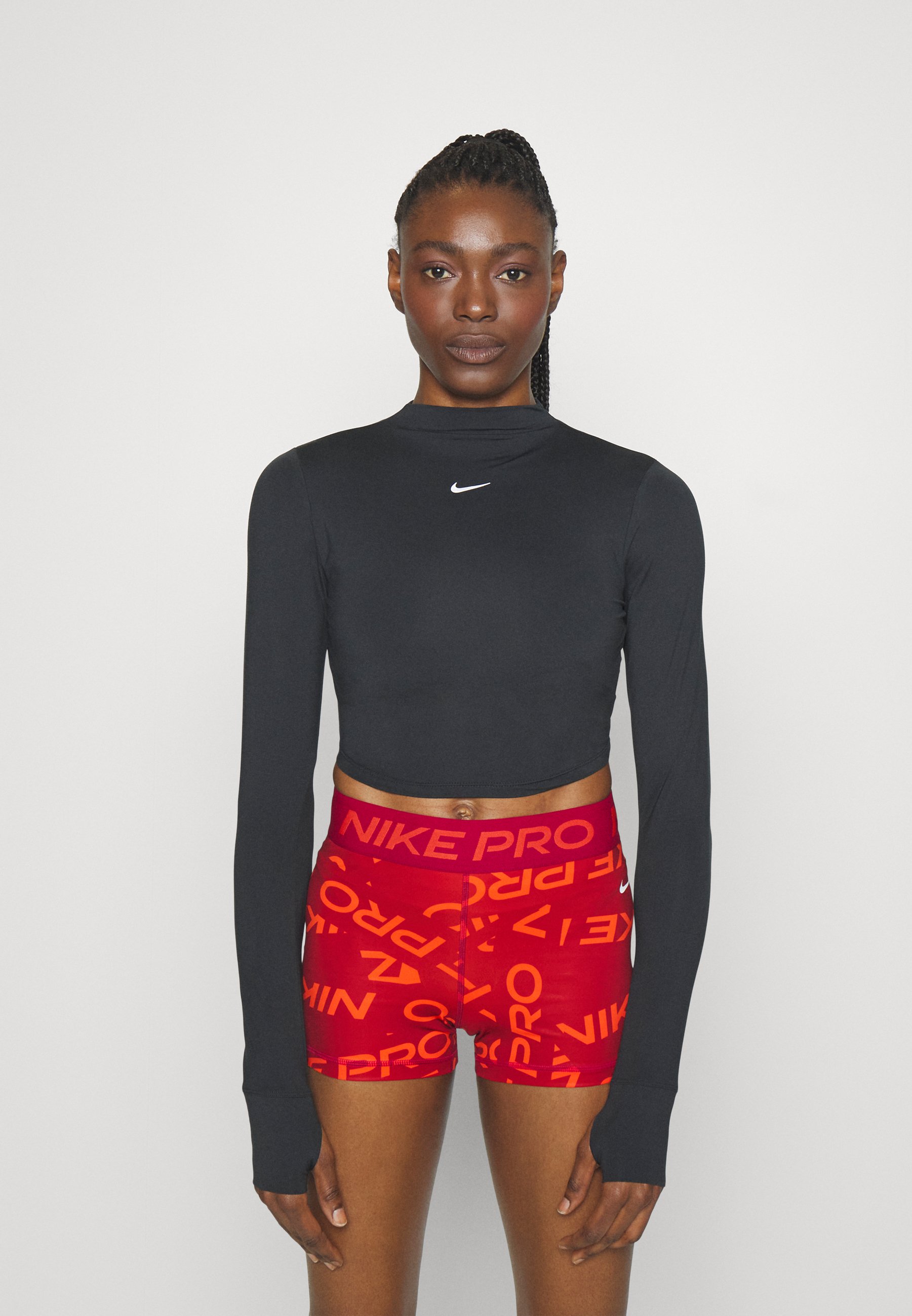 W NK ONE LUXE DF LS CROP ESS - Long sleeved top