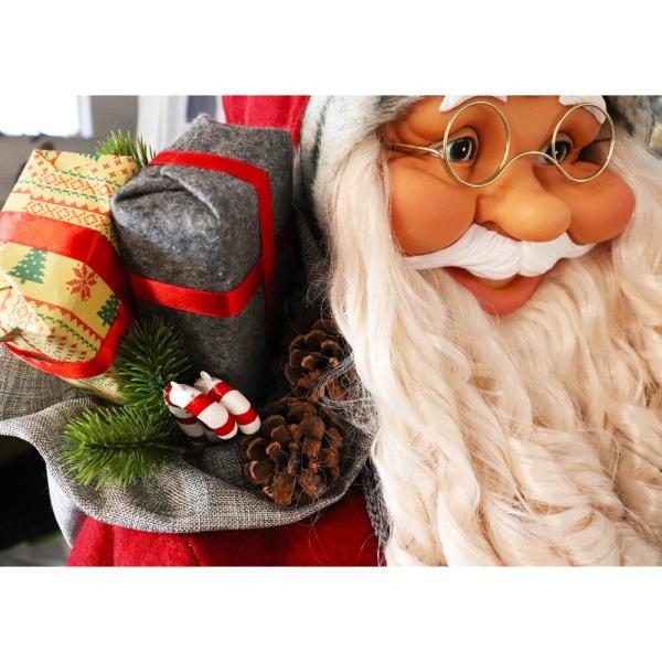 5 ft. Christmas Standing Santa Claus Holding Snowshoes and Wearing a Nordic Sweater