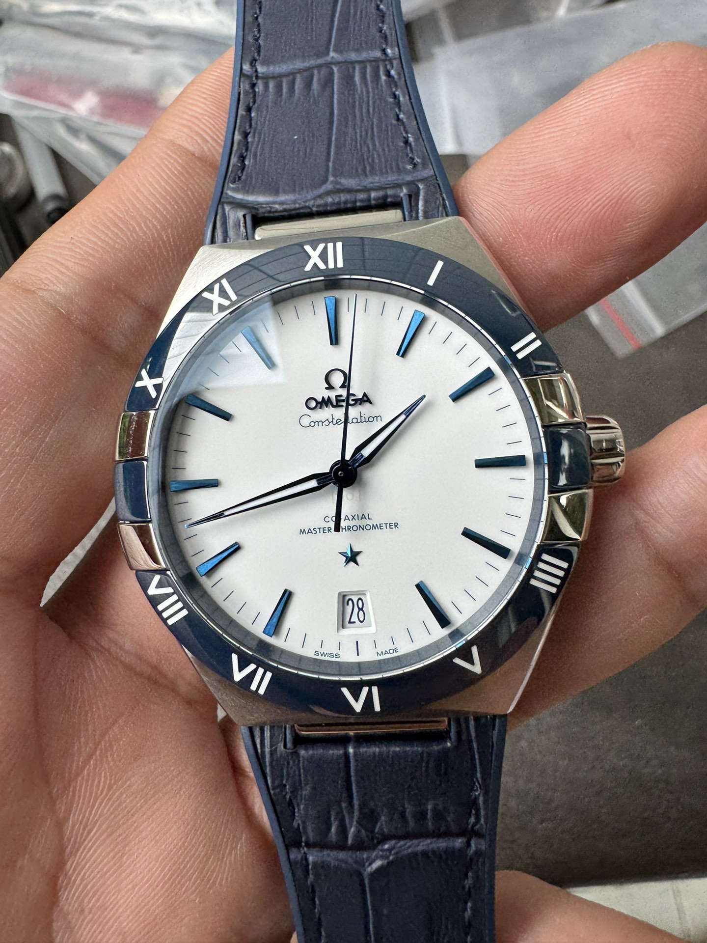 Super Clone 1:1 Omega Constellation Co-Axial Master Chronometer – White Dial Blue Roman Bezel Leather Strap