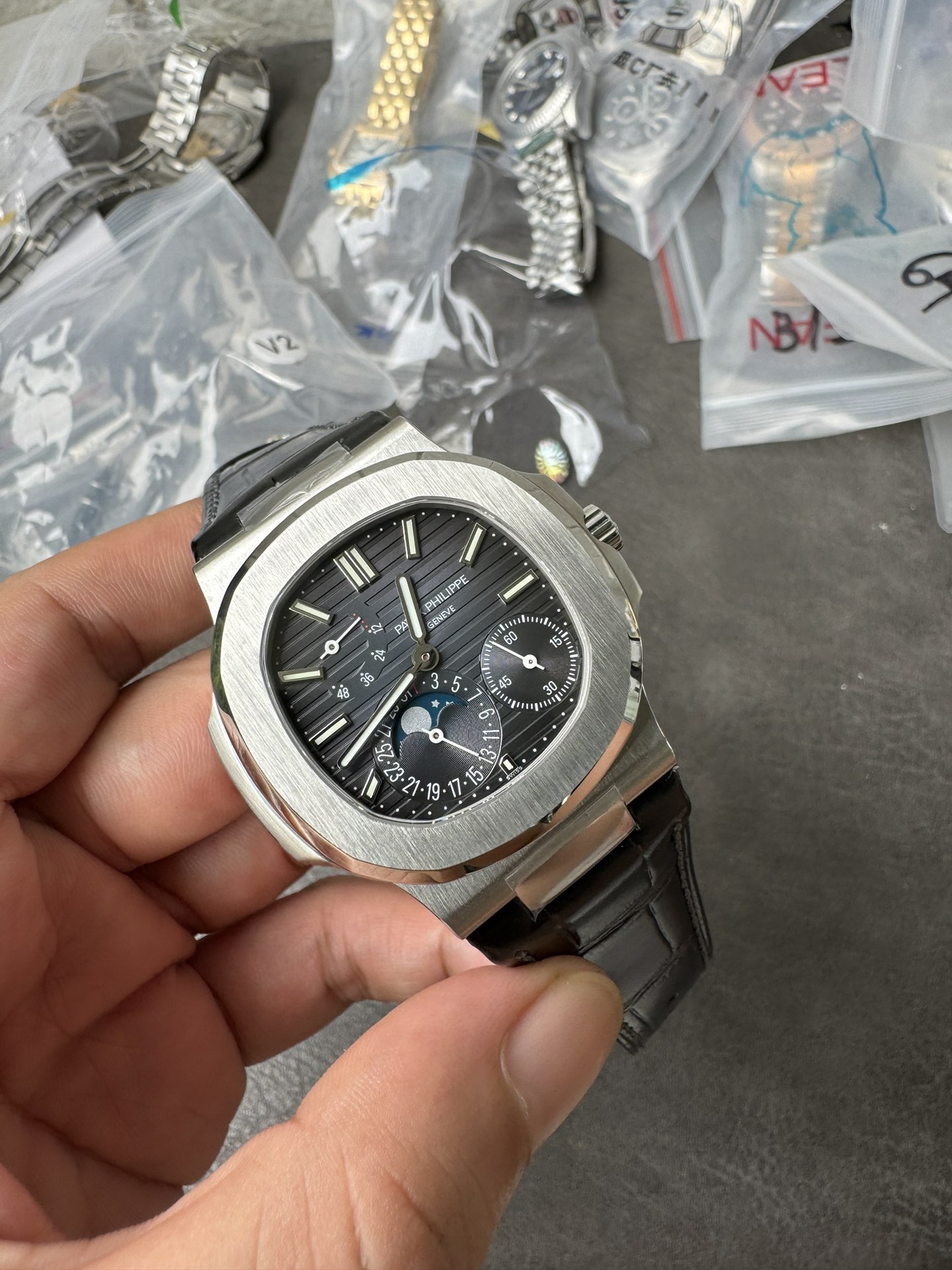 Super Clone 1:1 Patek Philippe Nautilus 5712G – White Gold / Black Textured Dial / Moonphase & Power Reserve Display / Black Leather Strap