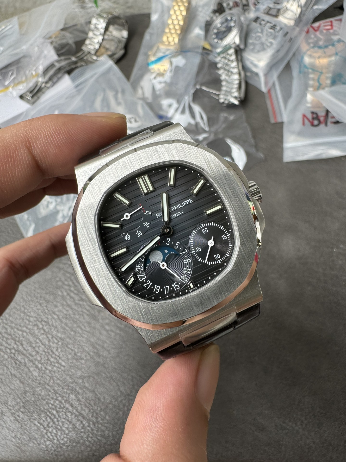 Super Clone 1:1 Patek Philippe Nautilus 5712G – White Gold / Black Textured Dial / Moonphase & Power Reserve Display / Black Leather Strap