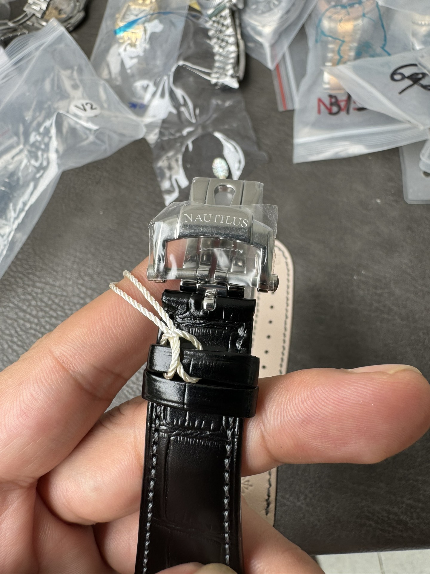 Super Clone 1:1 Patek Philippe Nautilus 5712G – White Gold / Black Textured Dial / Moonphase & Power Reserve Display / Black Leather Strap