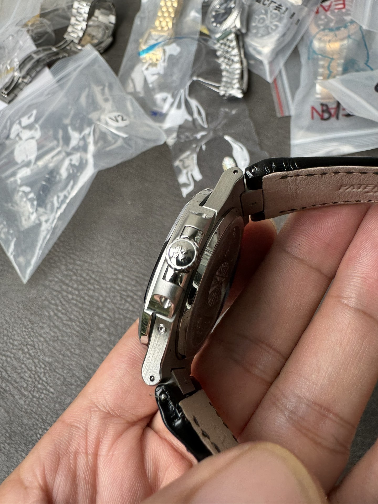 Super Clone 1:1 Patek Philippe Nautilus 5712G – White Gold / Black Textured Dial / Moonphase & Power Reserve Display / Black Leather Strap