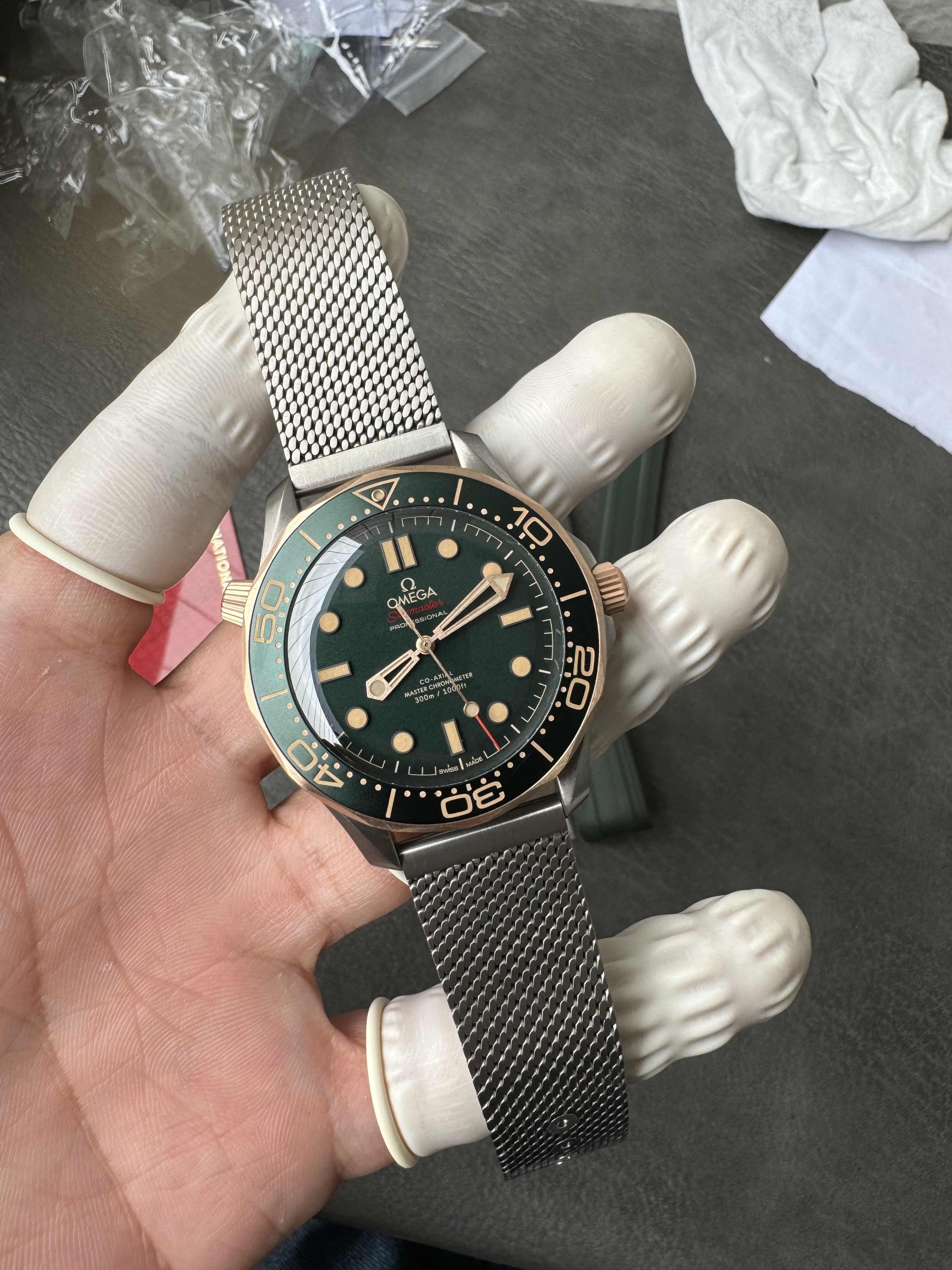 Super Clone OMEGA 1:1  Seamaster 300M 007 Edition 2025 Bronze Gold with Titanium Mesh Strap 42mm Diver Watch