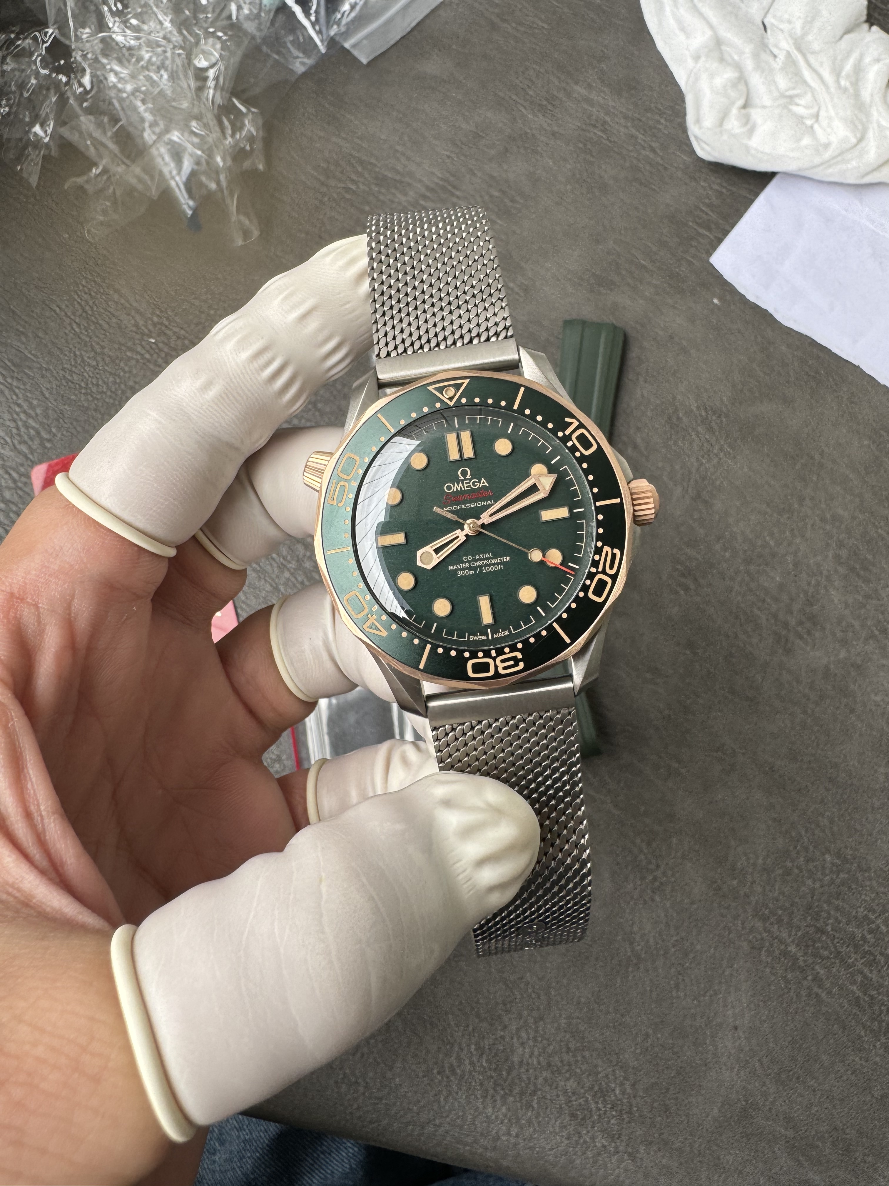 Super Clone OMEGA 1:1  Seamaster 300M 007 Edition 2025 Bronze Gold with Titanium Mesh Strap 42mm Diver Watch