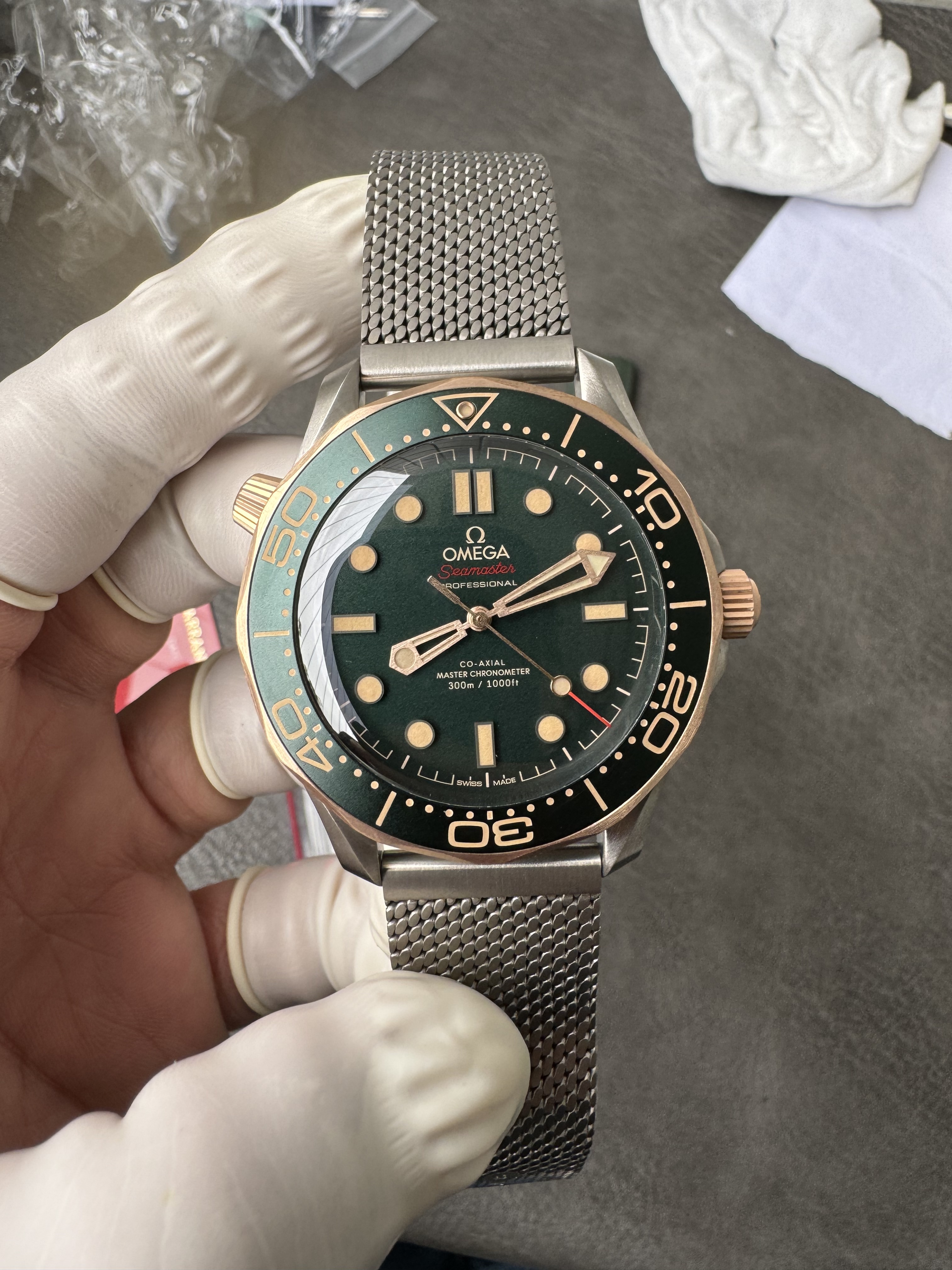 Super Clone OMEGA 1:1  Seamaster 300M 007 Edition 2025 Bronze Gold with Titanium Mesh Strap 42mm Diver Watch