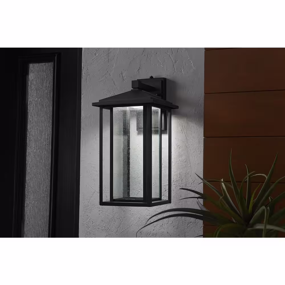 Home Decorators Collection Mauvo Canyon Black Dusk to Dawn Large LED Outdoor Wall Light Fixture with Seeded Glass