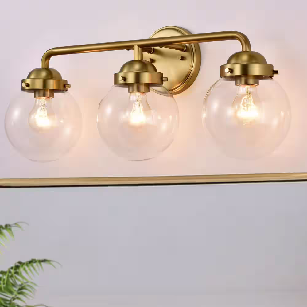C Cattleya 3 Light Antique Brass Vanity Light with Globe Clear Glass Shade