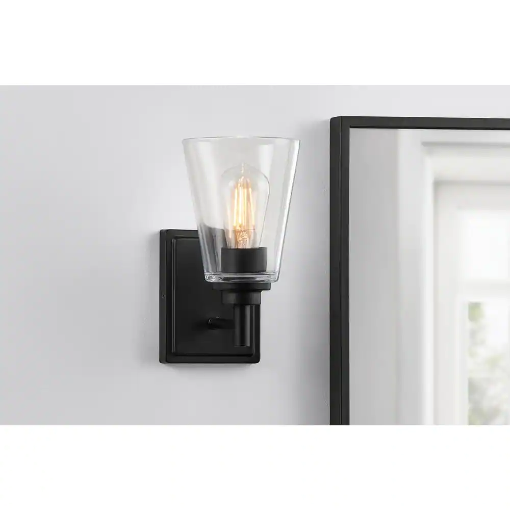Hampton Bay Wakefield 5.25 in. 1-light Matte Black Modern indoor wall sconce with Clear Glass Shade