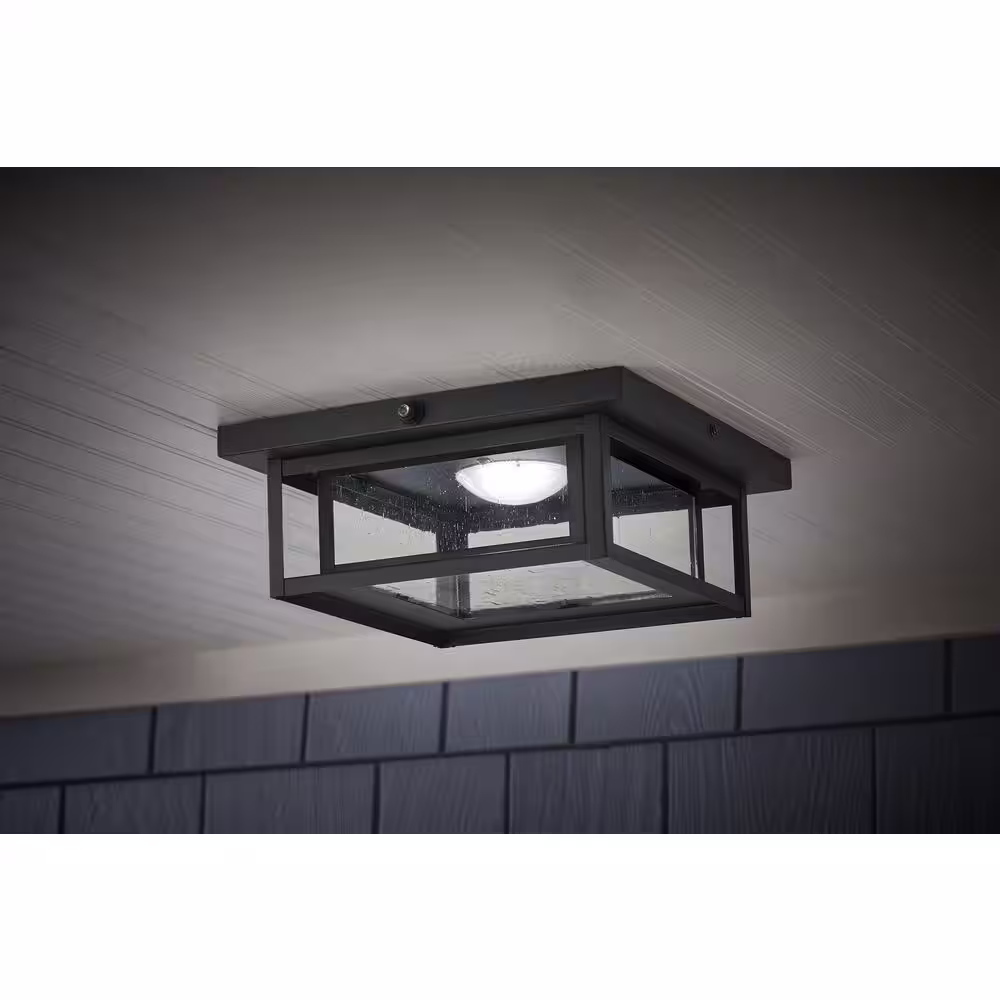Home Decorators Collection Mauvo Canyon Black Dusk to Dawn LED Outdoor Flush Mount Ceiling Light Fixture with Seeded Glass