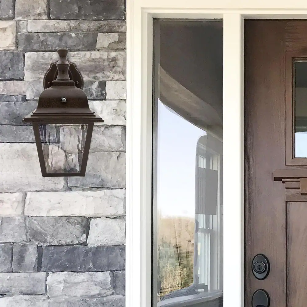 Maxxima 1-Light Aged Bronze LED Outdoor Wall Lantern Sconce with Clear Water Glass and Dusk to Dawn Sensor