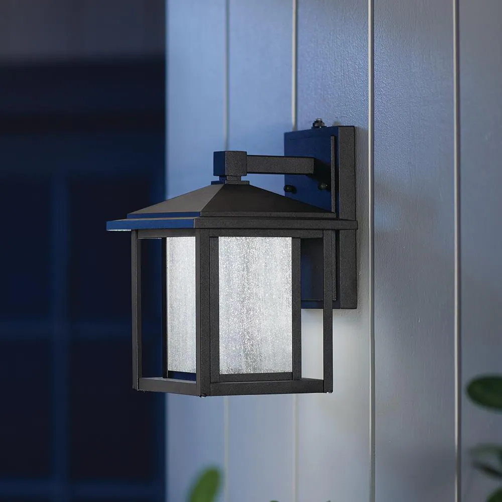 Home Decorators Collection Mauvo Canyon Black Dusk to Dawn Small LED Outdoor Wall Light Fixture with Seeded Glass