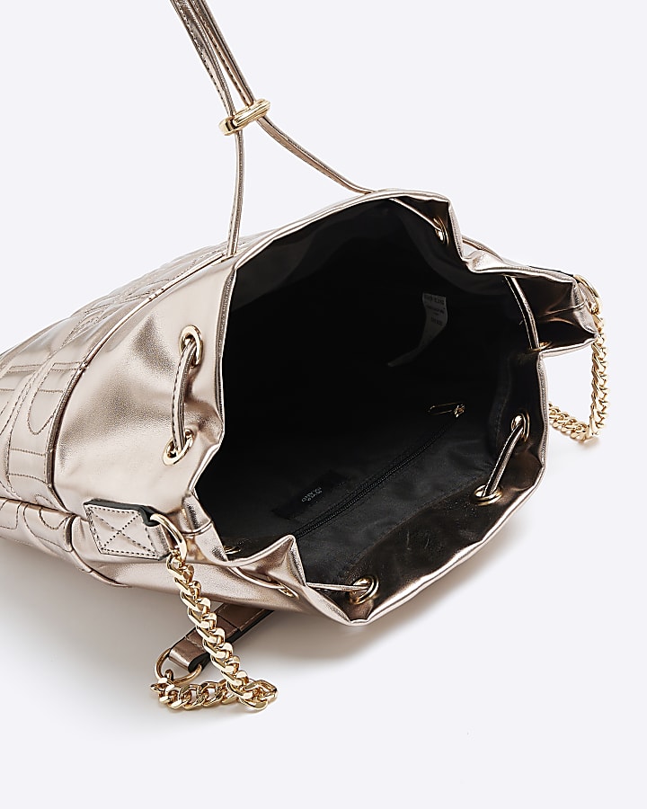 Gold quilted drawstring shoulder bag