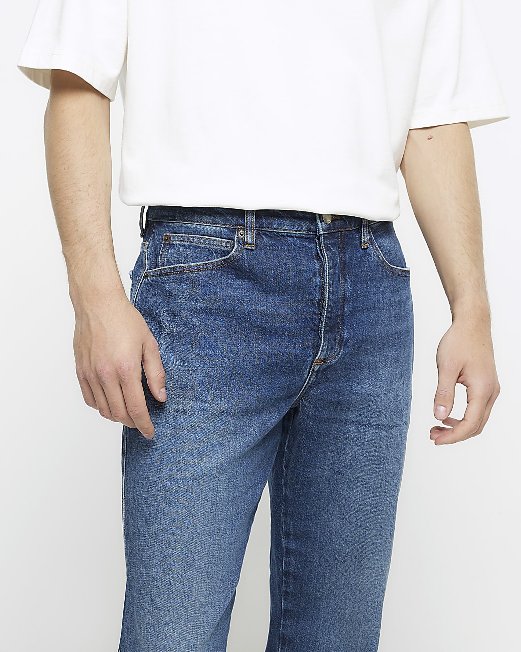 Blue tapered fit faded jeans