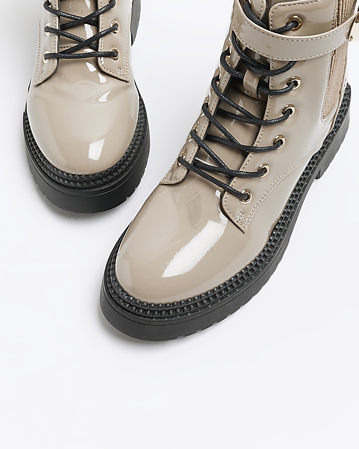 Beige patent buckle lace up boots
