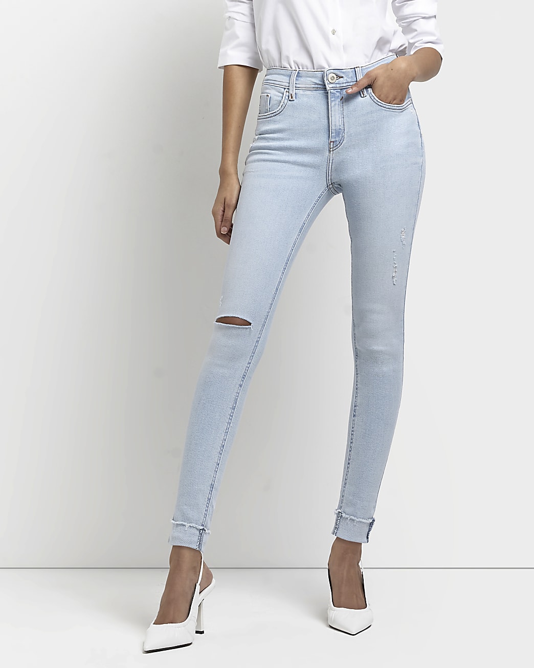 Blue ripped mid rise skinny jeans