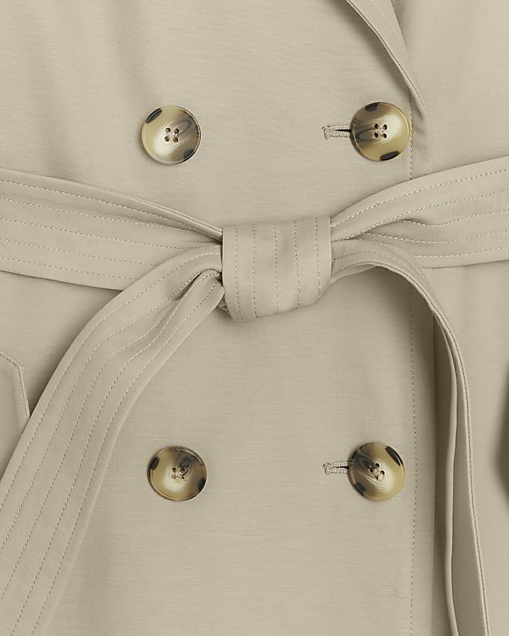 Beige double breasted trench coat