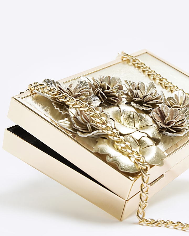Gold flower detail clutch bag