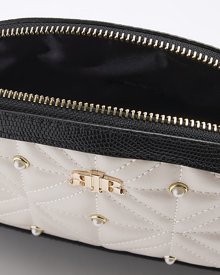 Cream quilted pearl makeup bag