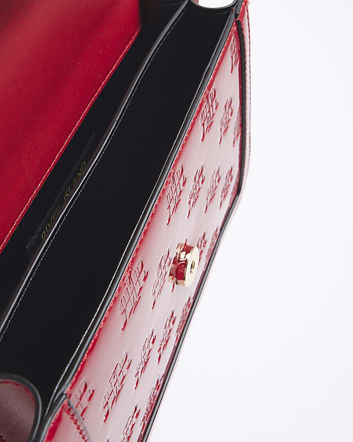Red embossed RI lock shoulder bag