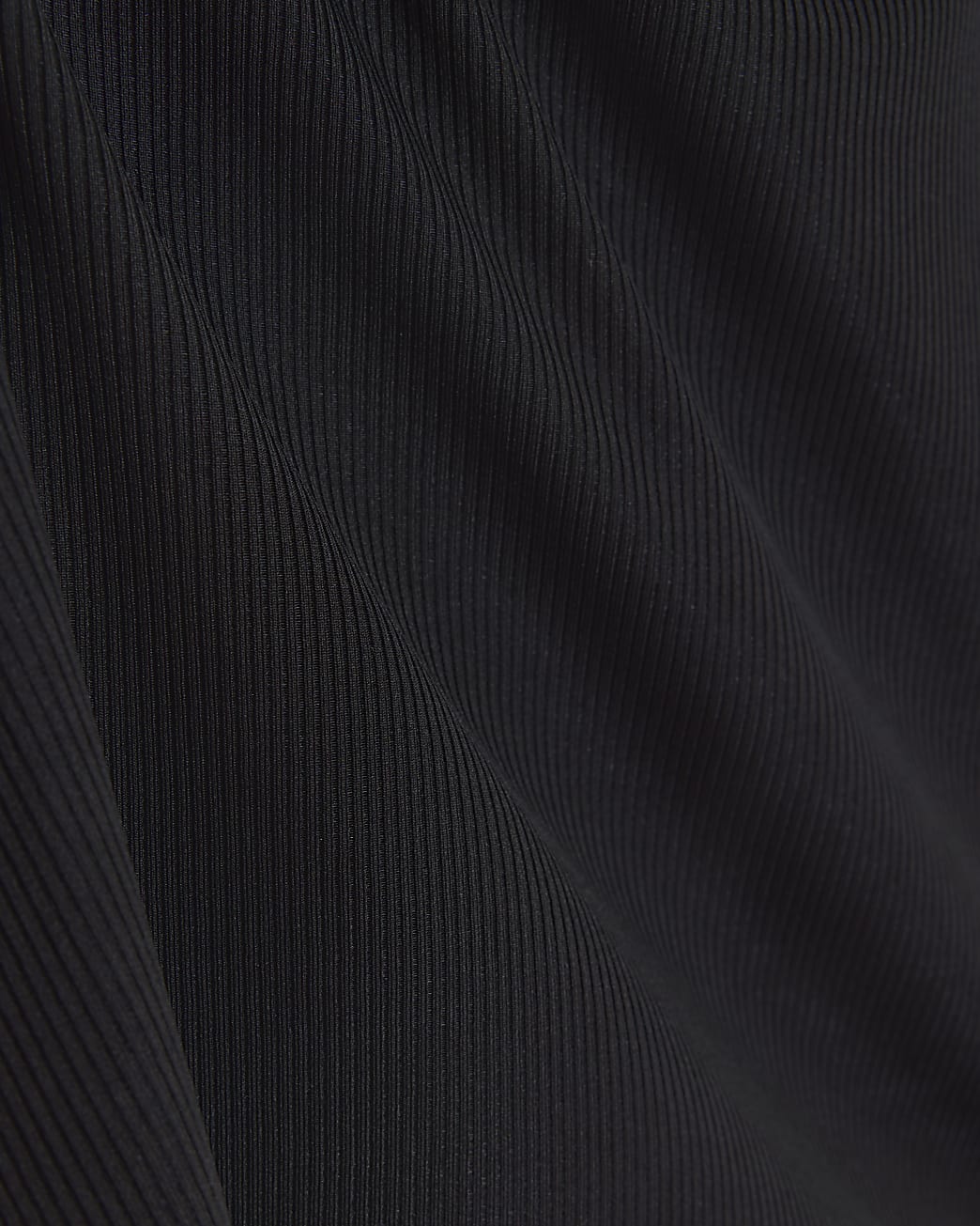 Plus black asymmetrical o-ring ribbed top