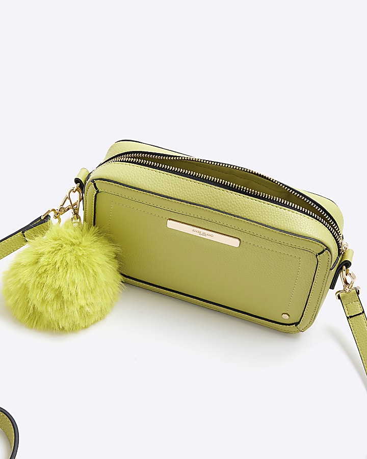 Green faux leather pom pom cross body bag
