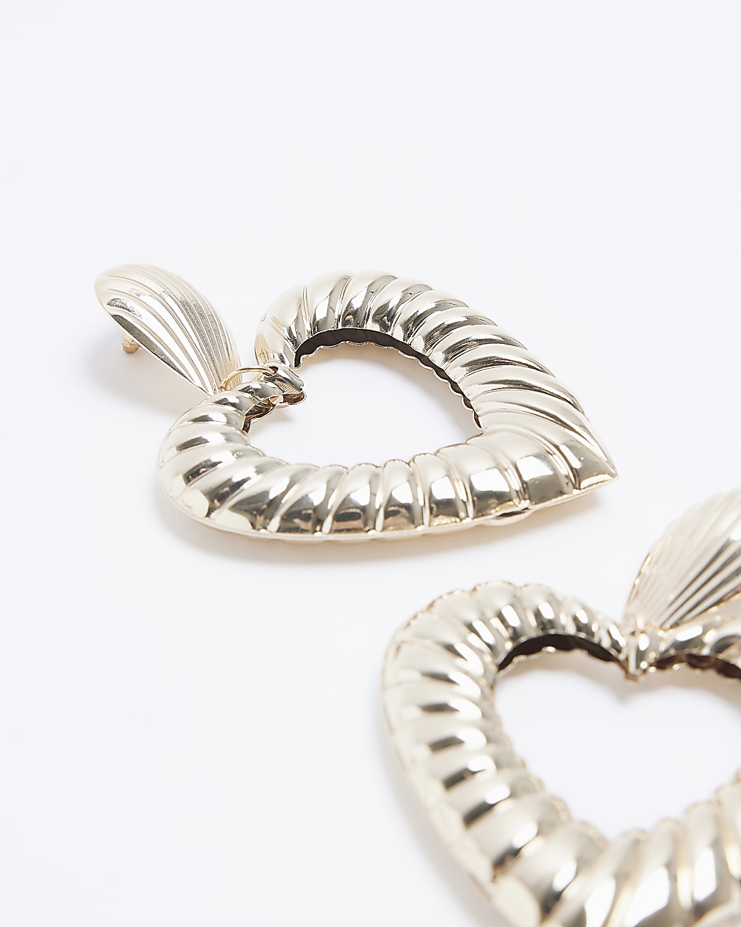 Gold heart design drop earrings
