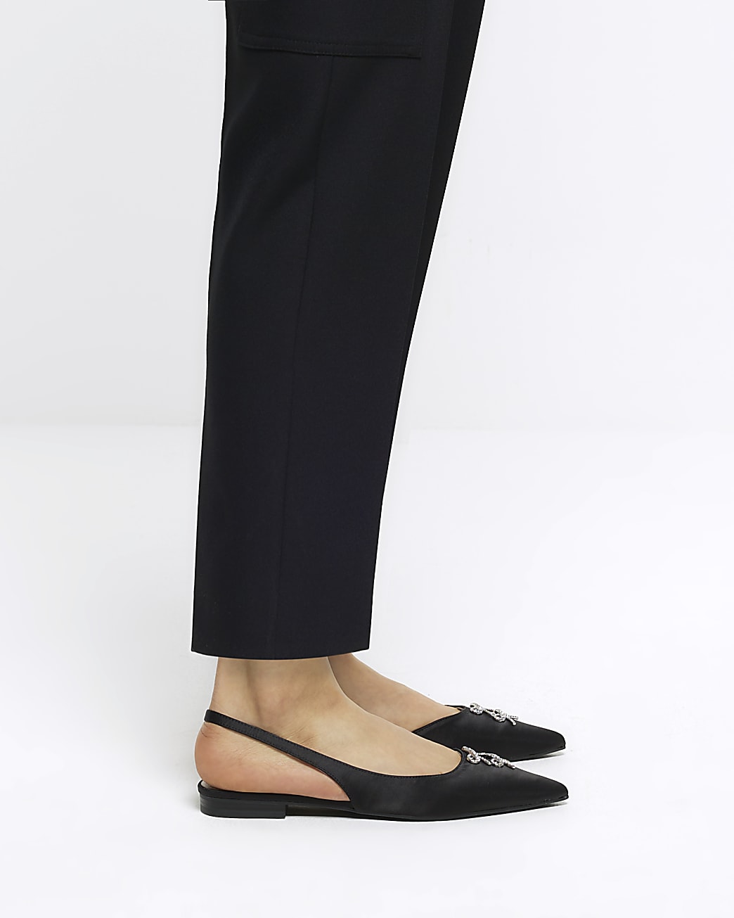 Black pointed slingback shoes