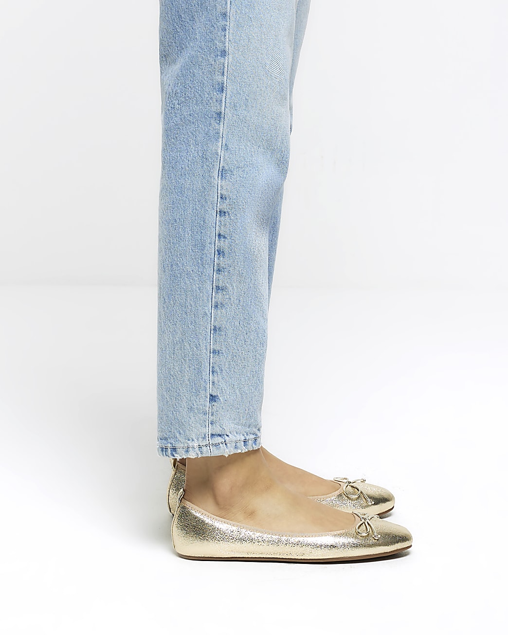 Gold bow ballet pumps