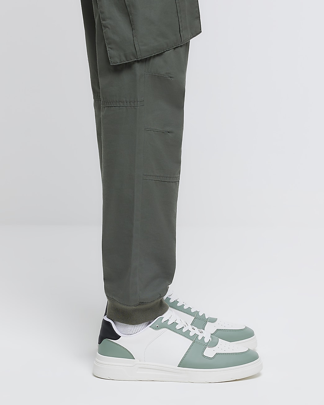 Green low top trainers