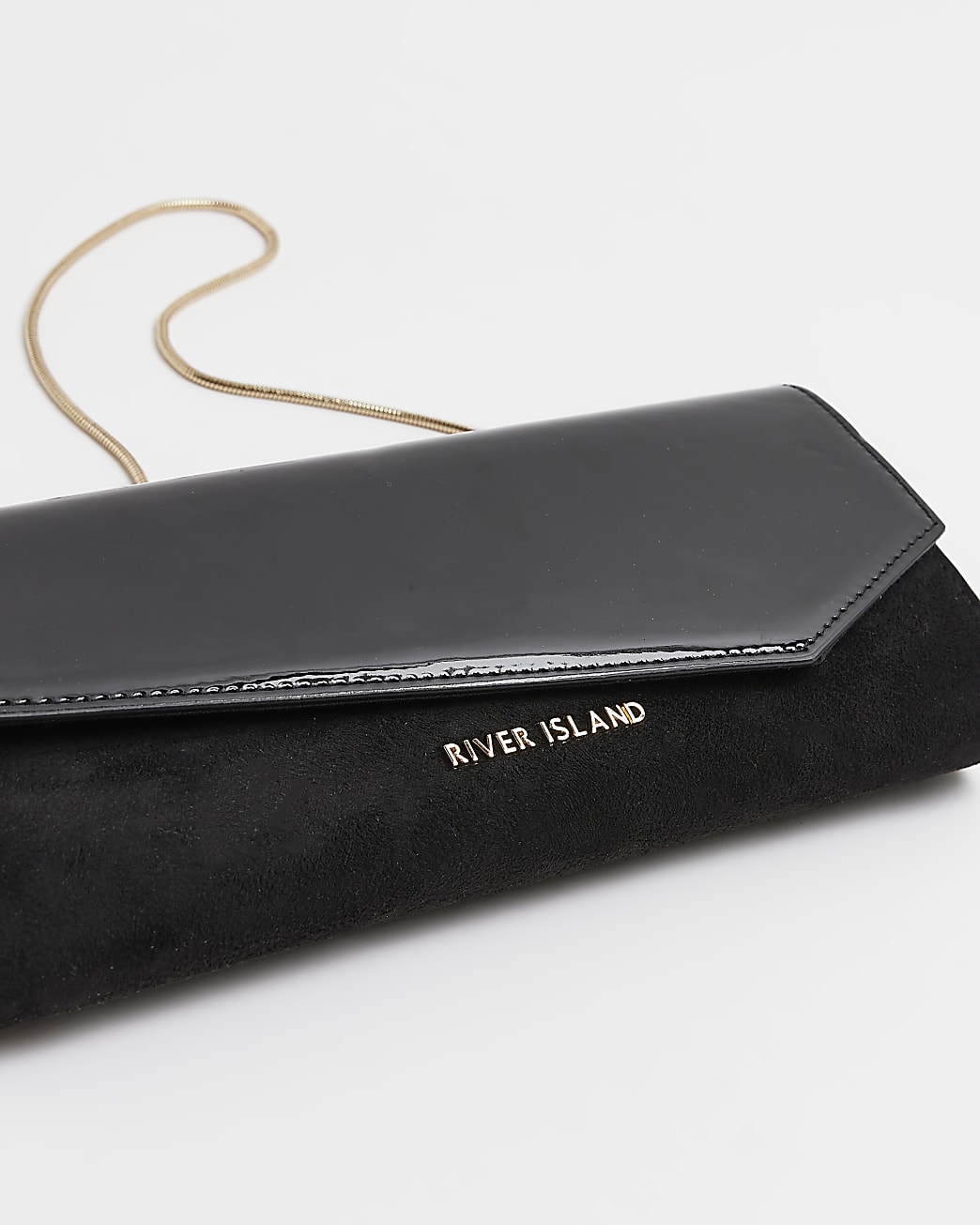 Black patent asymmetric clutch bag