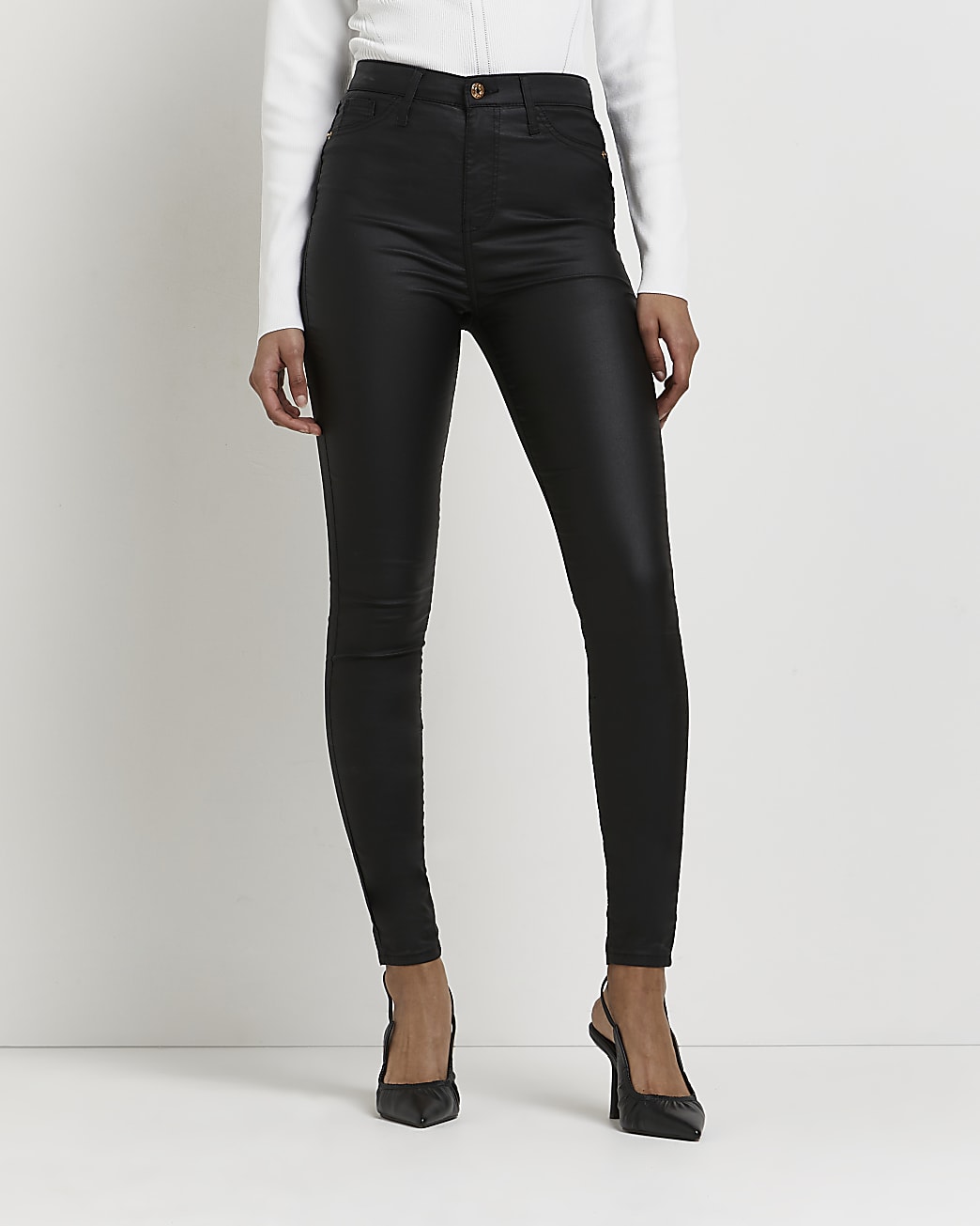 Black coated high waisted skinny jeans