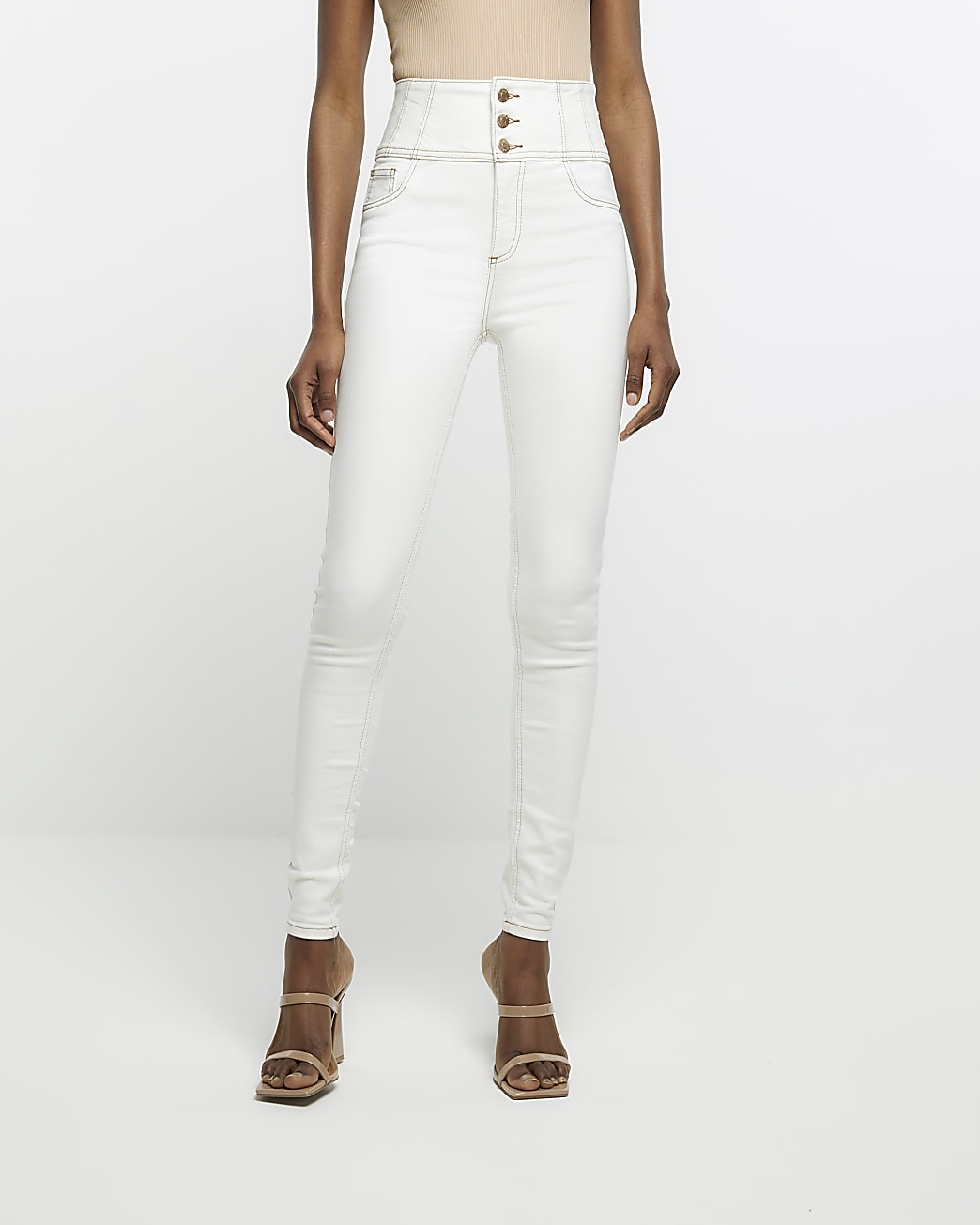 Ecru high waisted corseted skinny jeans