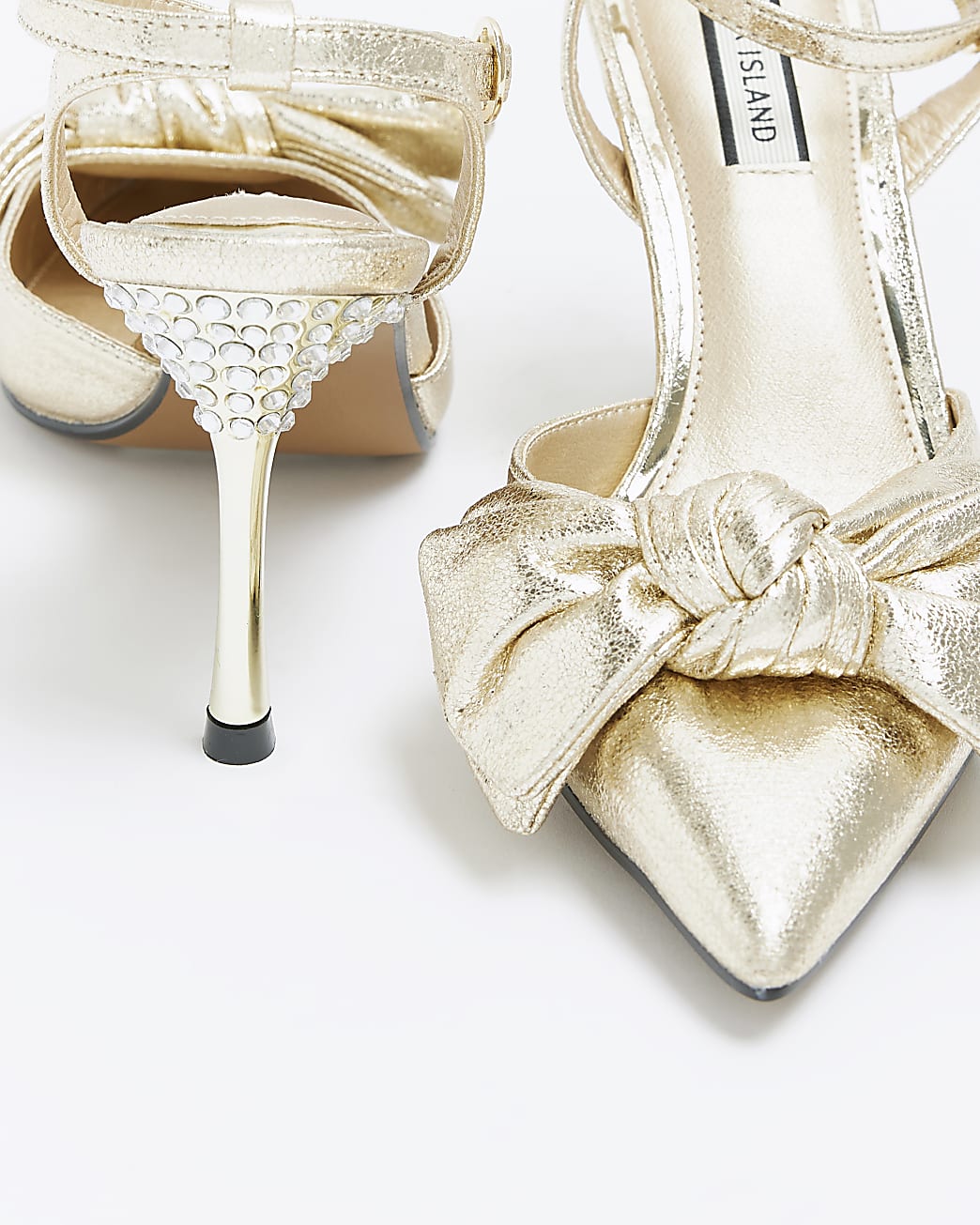 Gold bow heeled court shoes