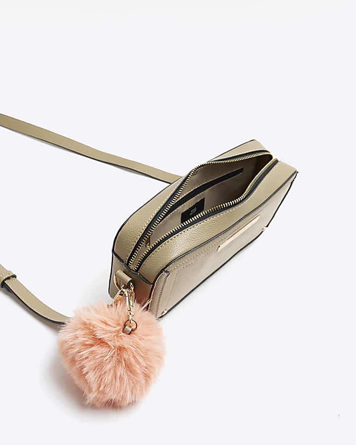 Beige suedette pom pom cross body bag