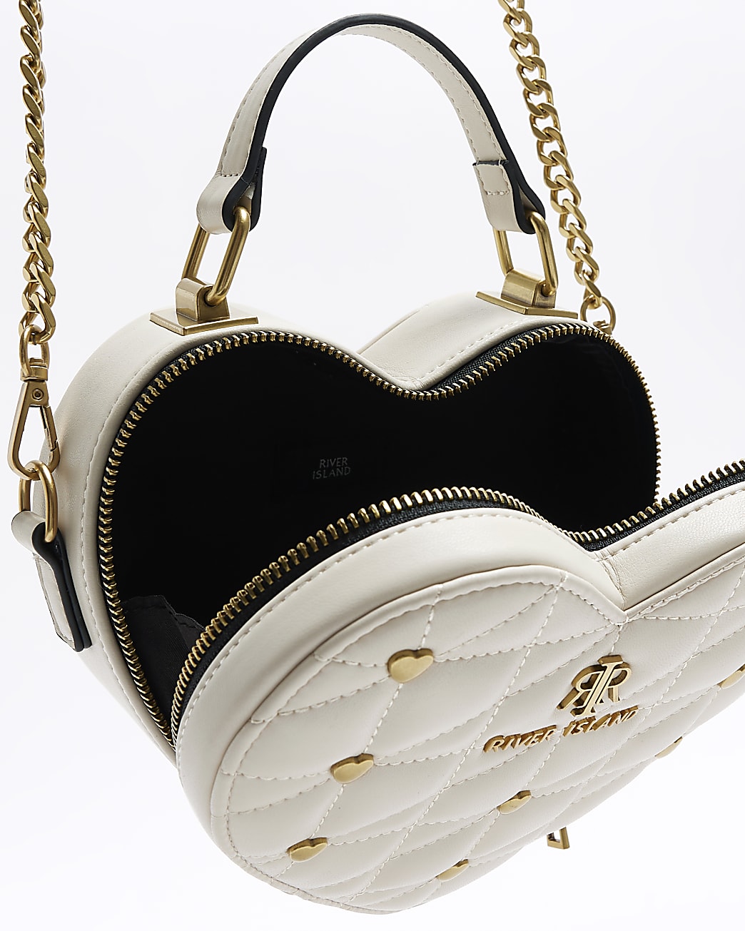 Cream patent heart cross body bag