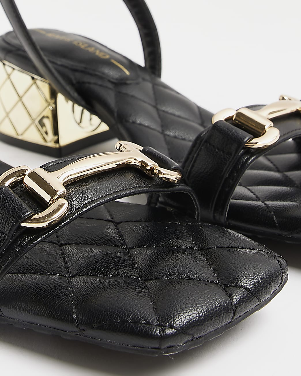 Black quilted heeled sandals